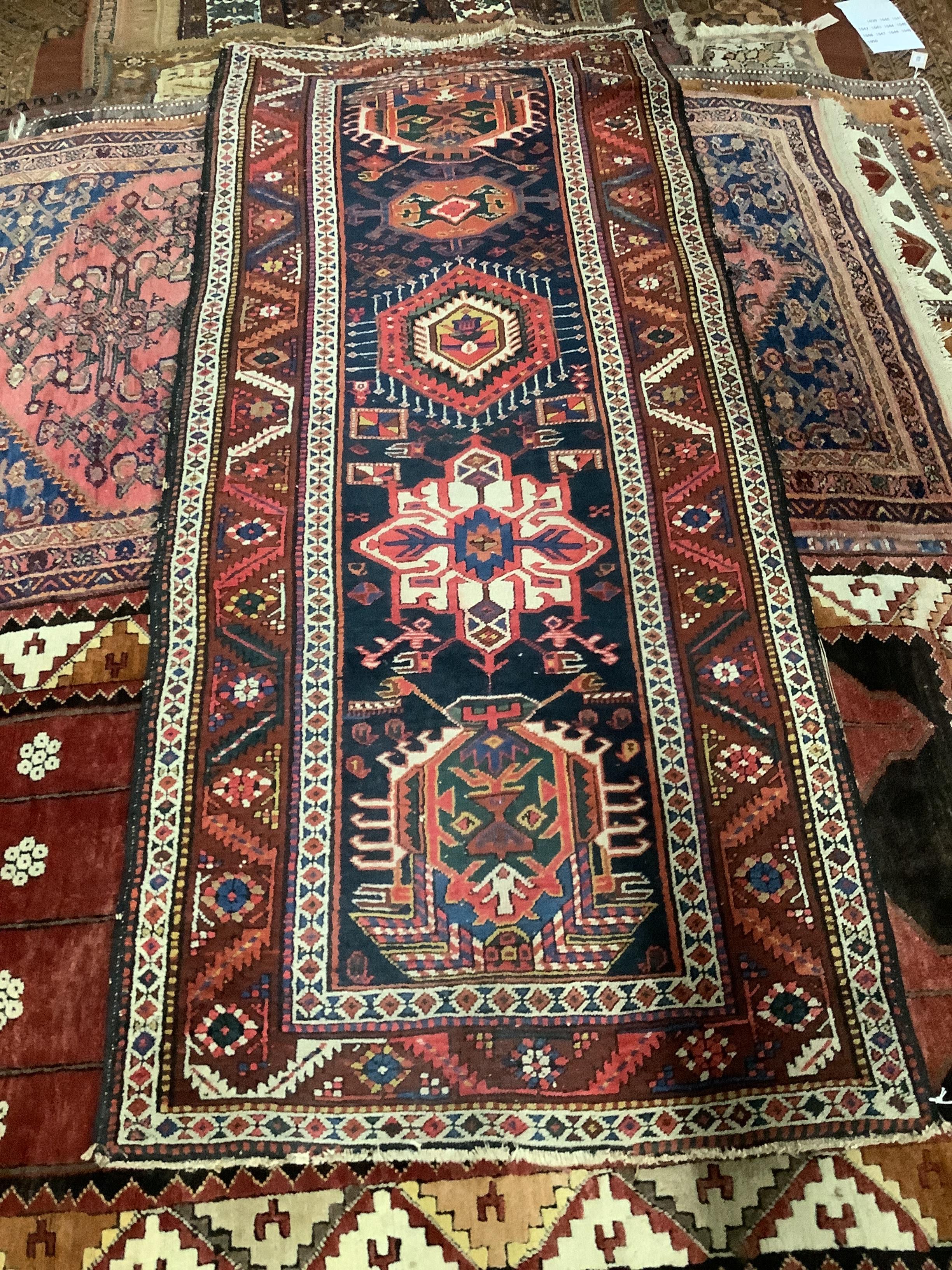 A Caucasian blue ground rug, 231 x 97cm